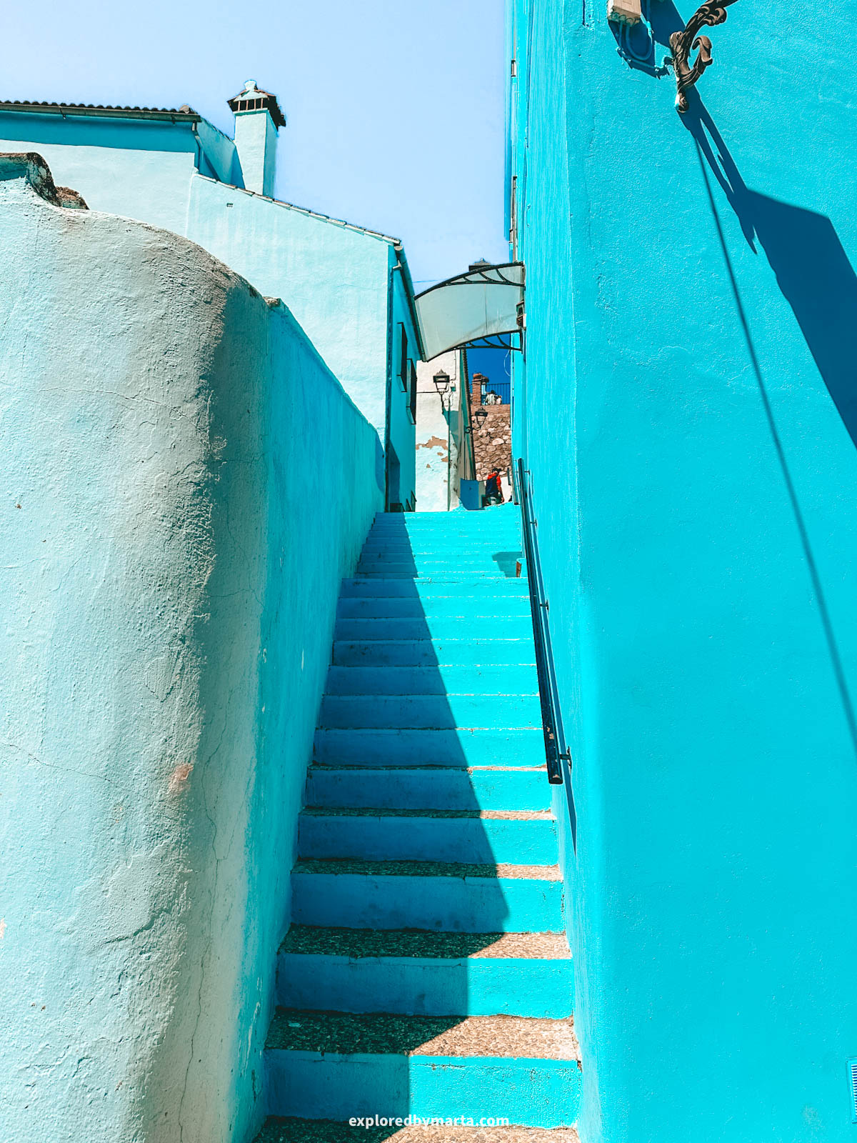 Beautiful blue painted stairs in Juzcar village in Spain