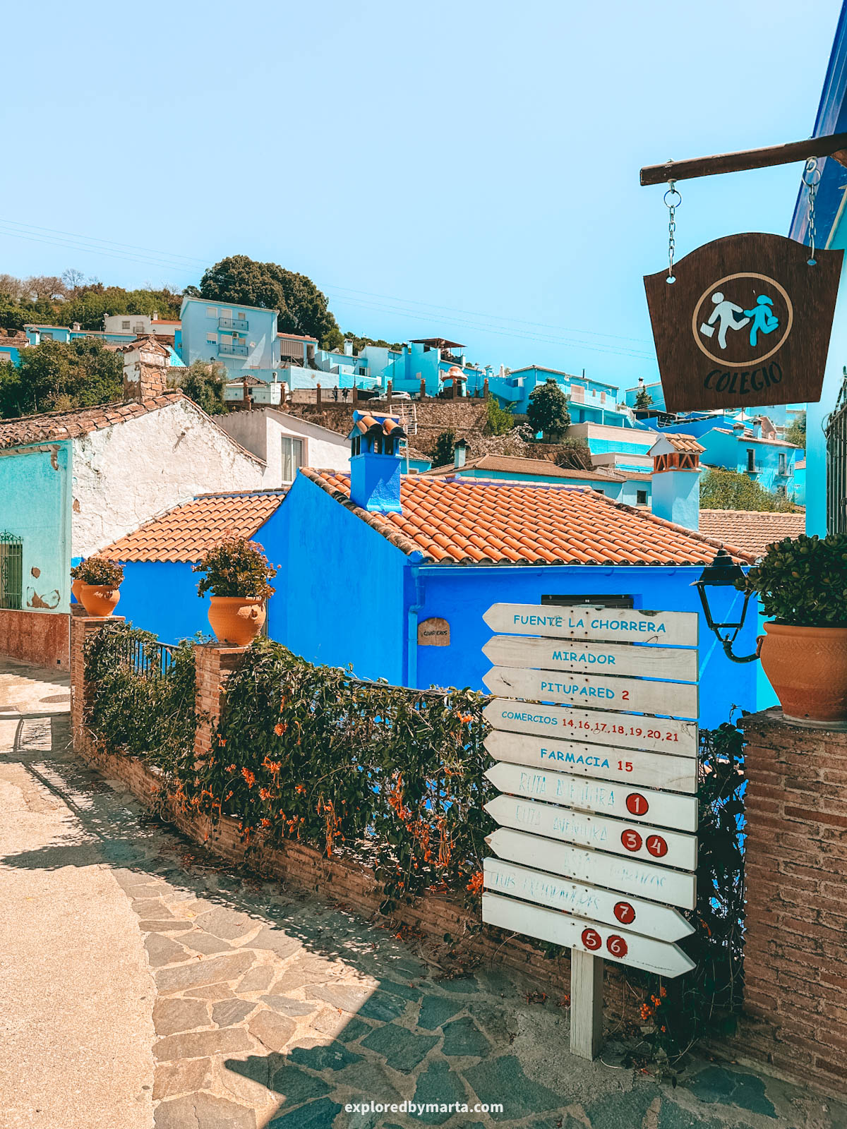 Calle Iglesia with blue houses in the blue village of Juzcar in Spain