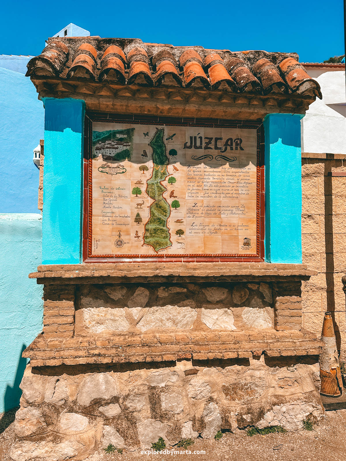 Information board about Júzcar village in Spain