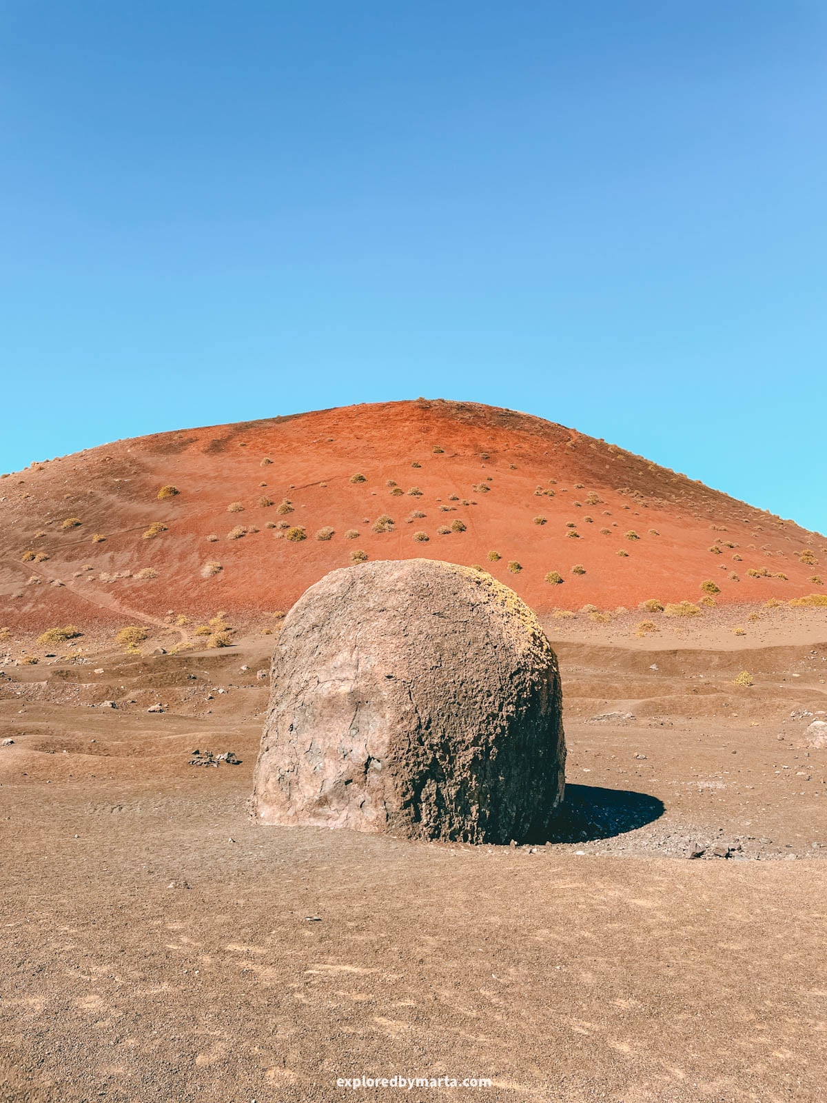 Giant volcanic bomb at Montaña Colorada in Lanzarote, Spain