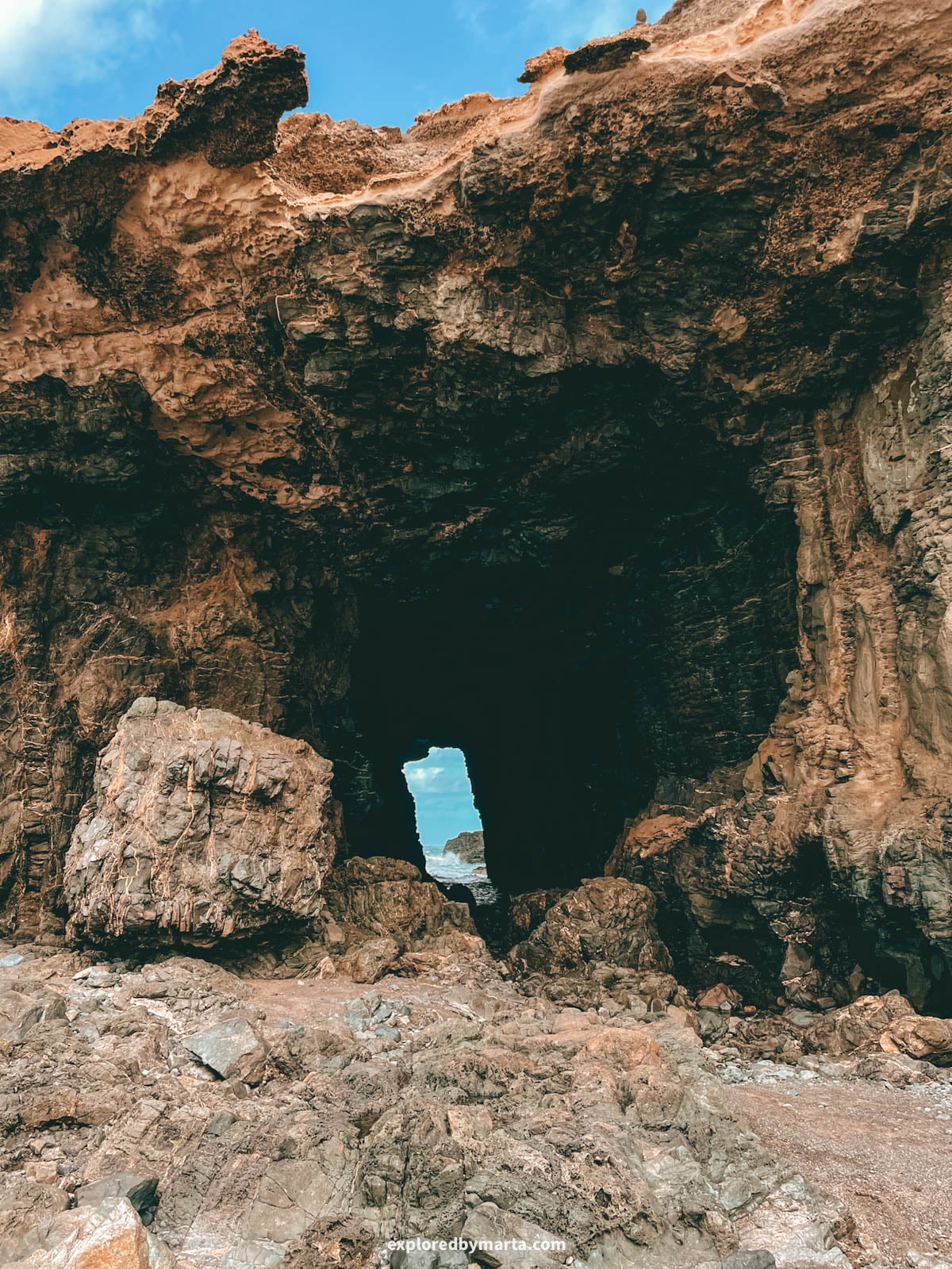 Natural rock window near Playa de Garcey in Fuerteventura, Spain