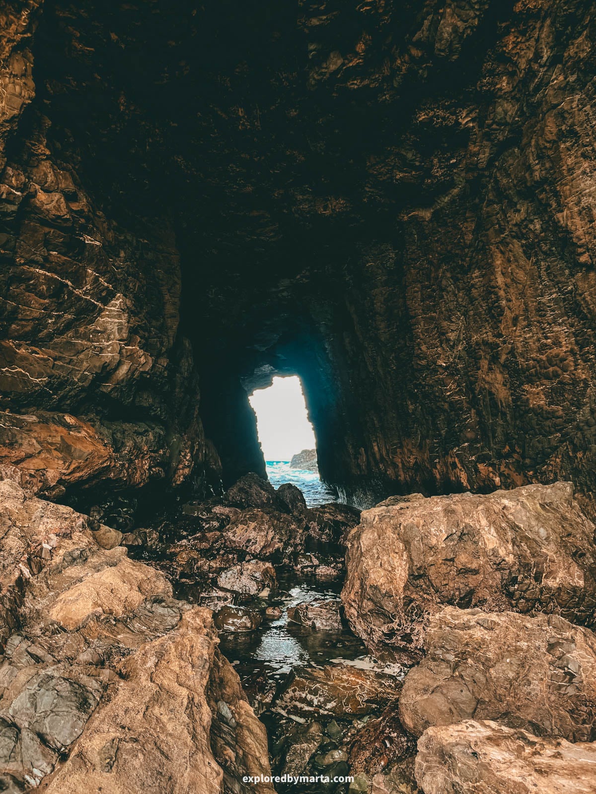 Natural rock window near Playa de Garcey in Fuerteventura, Spain