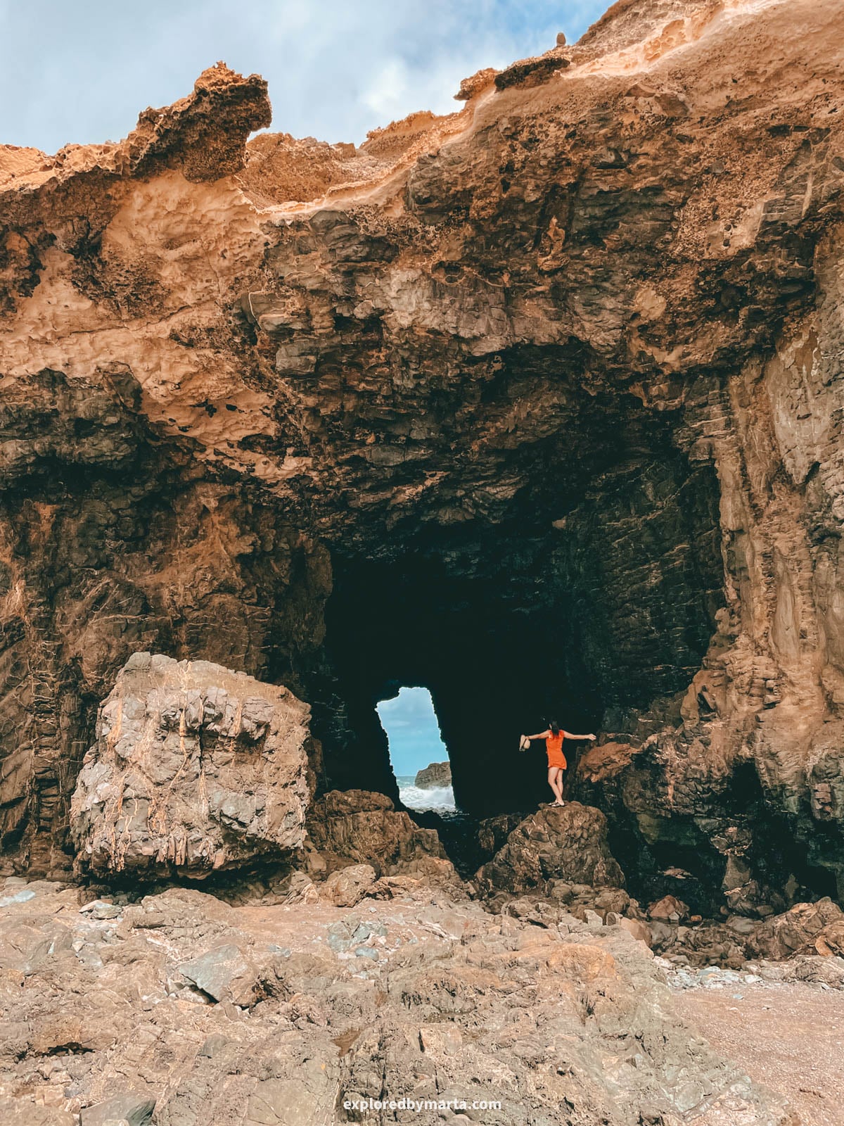 Natural rock window near Playa de Garcey in Fuerteventura, Spain