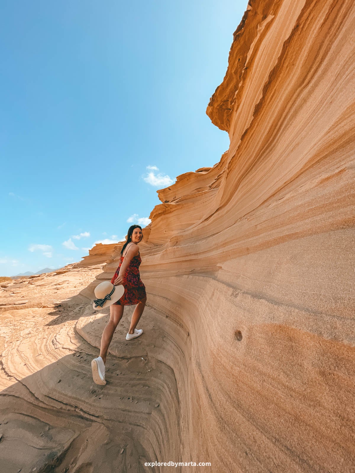 Sandstone wave rock formation at Playa de Cofete beach in Fuerteventura, Spain